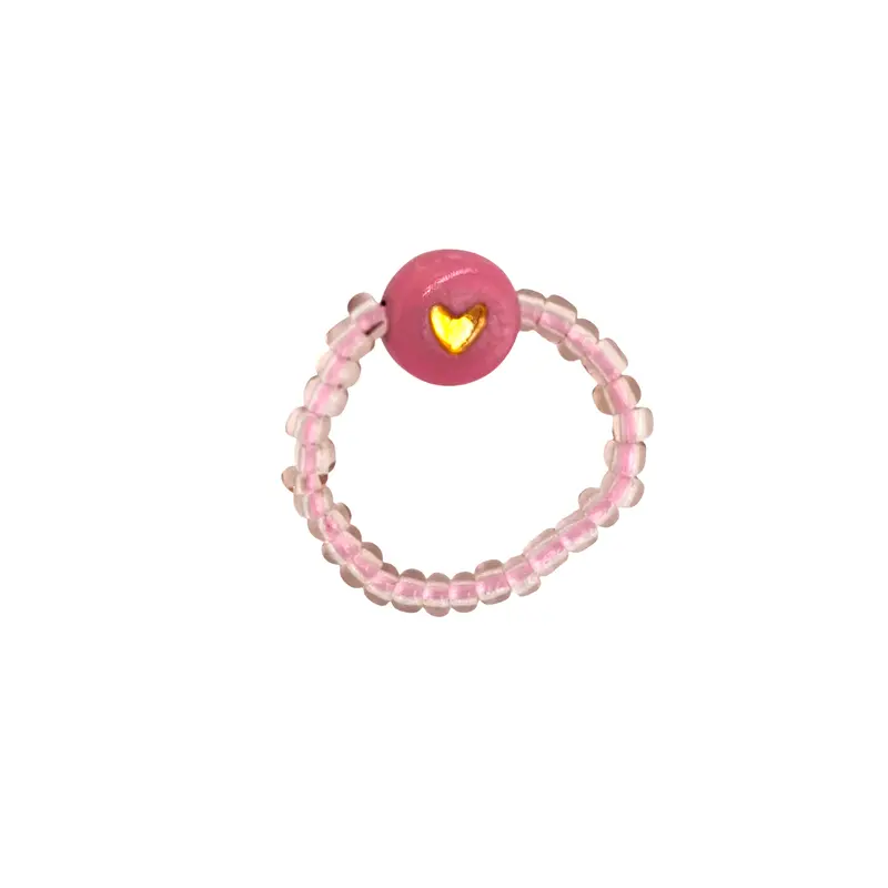 Feestbeest Ring roze met rond gouden hartje