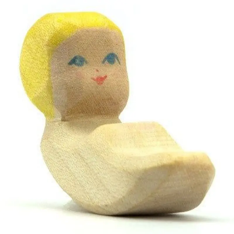Kind voor in kribbe